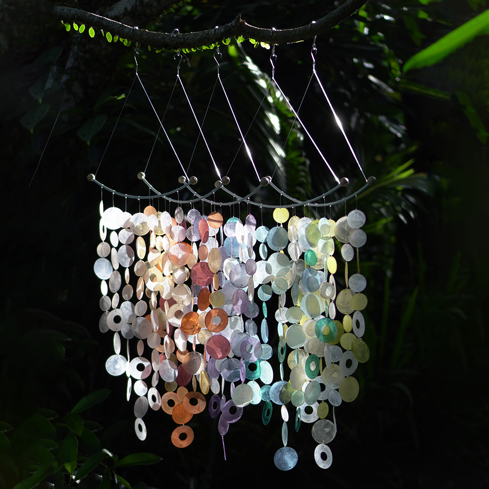 Capiz Shell Inverted Arch Wind Chimes Decor Lavender showcasing colorful capiz shells in shades of lavender, pink, and green, designed to create a stunning visual and auditory experience when hung in a garden.
