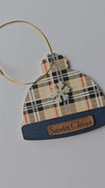 Load and play video in Gallery viewer, Personalized Designer Tan and Navy Plaid Winter Beanie Hat Ornament With Custom Leather Name Patch
