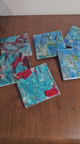 Charger et lire la vidéo dans la visionneuse de la galerie, Turquoise and Red Resin on Ceramic Glass Drink Coasters 4 x 4 Inch Square

