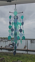 Load and play video in Gallery viewer, Handmade Capiz Criss Cross Top Teal Teardrop Wind Chimes Patio Decor 24"

