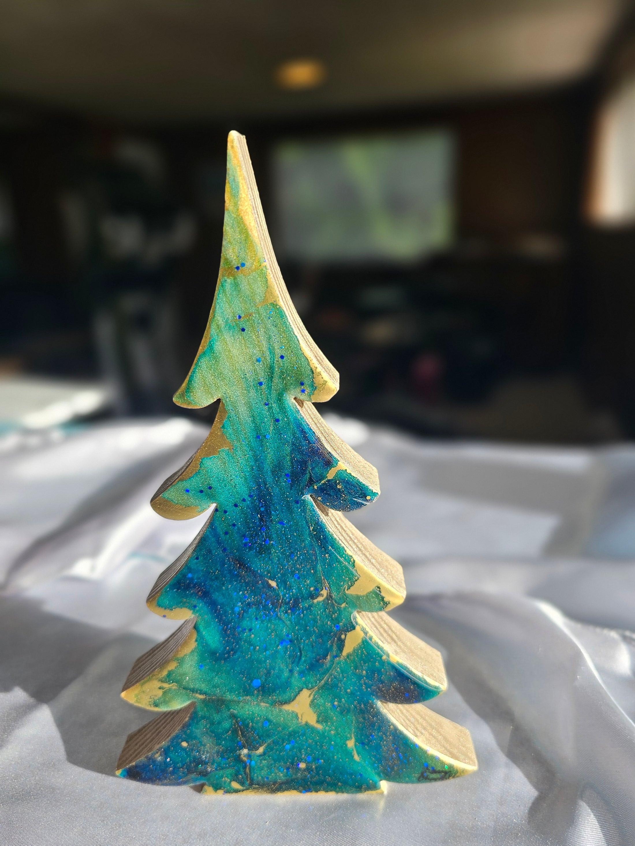 Handcrafted Blue-Green Tabletop Sparkly Christmas Trees 8 Inches displayed on a festive mantel, creating a charming holiday atmosphere.