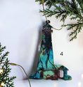 Charger l'image dans la visionneuse de la galerie, Turquoise and red handmade lighthouse resin and wood ornament on a white background with Christmas lights and boughs 
