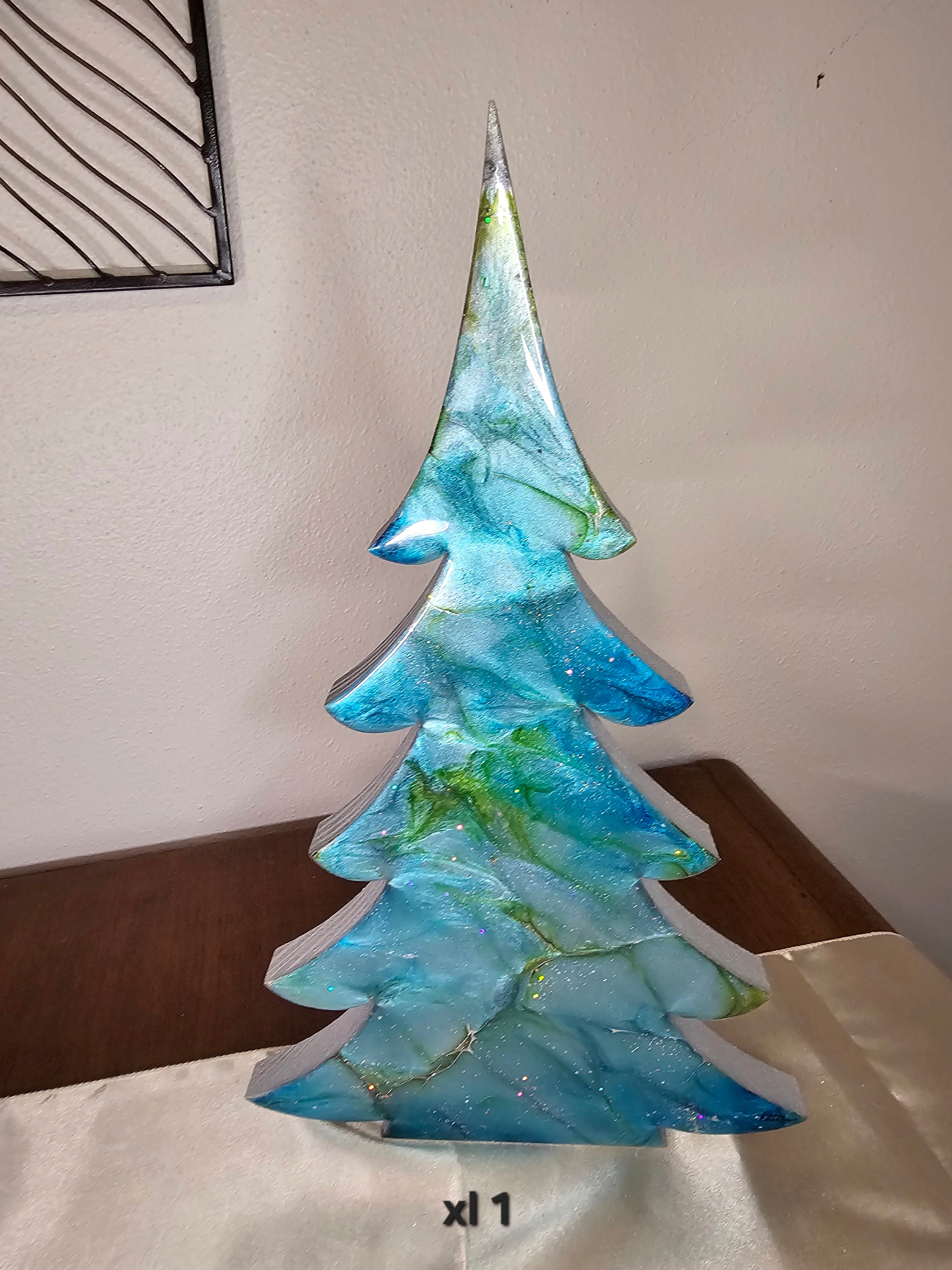 Close-up view of Handmade Blue Green Silver Resin Christmas Trees Holiday Mantelpiece decorations, highlighting handcrafted details and vibrant colors for your mantel.