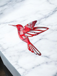 Charger l'image dans la visionneuse de la galerie, An elegant close-up of a hummingbird crafted from handmade resin on wood, featuring intricate details and shimmering finishes.
