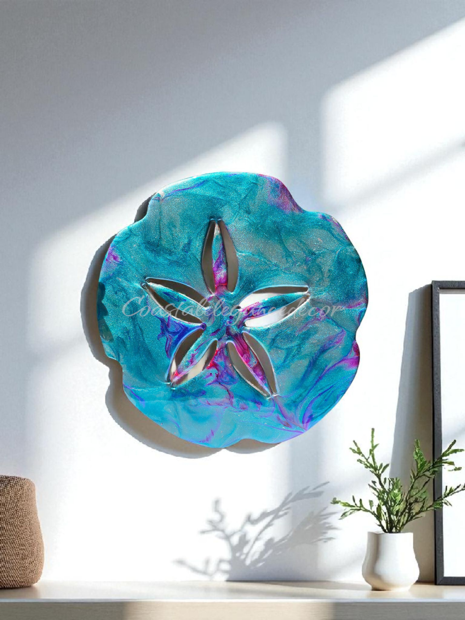 Colorful Beach Sand Dollar Wall Decoration Handmade by Coastal Elegance Decor, displayed in a bright indoor setting, emphasizing its unique design and eye-catching colors.