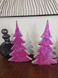 Load image into Gallery viewer, Stylish Hot Pink Silver Evergreen Christmas Trees Mantel Sitter Holiday Tabletop Decoration on a festive table.
