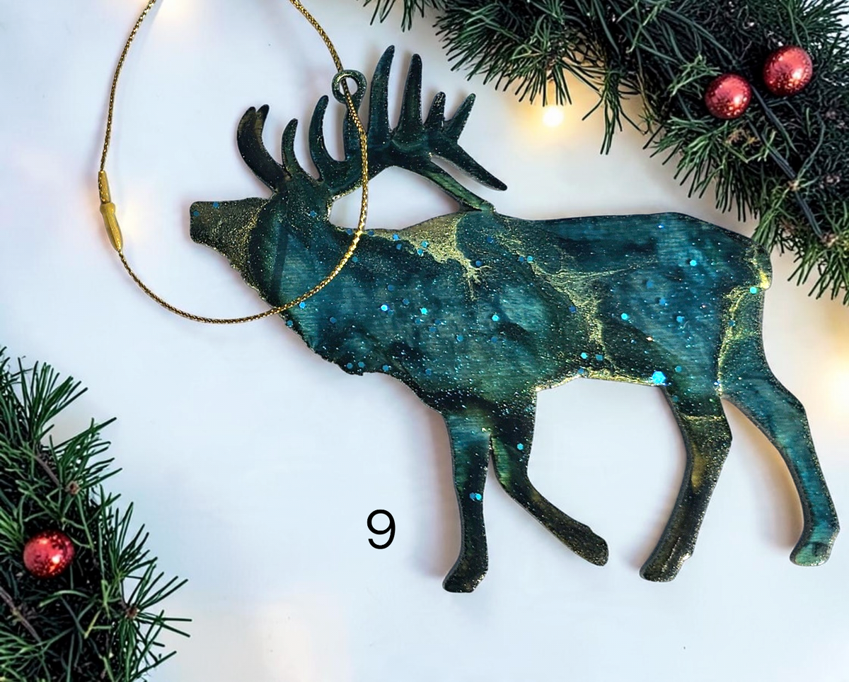 Handmade elk Christmas ornaments with lights and boughs