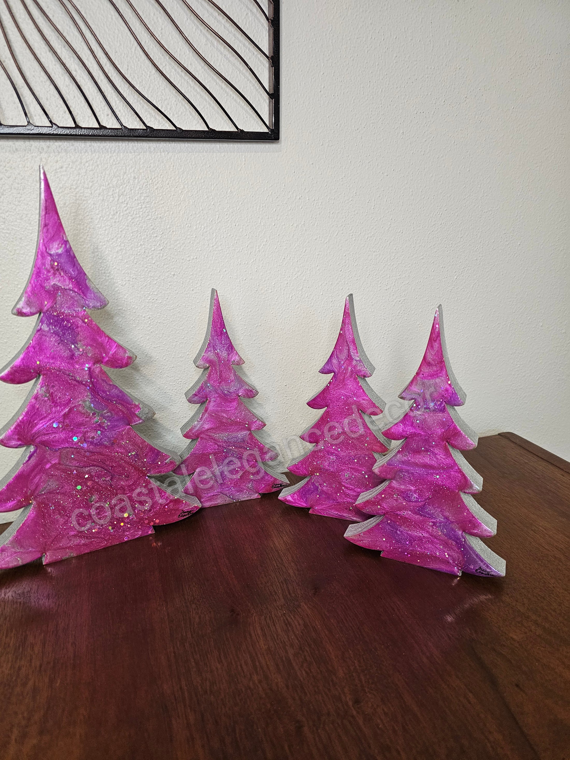 Set of Hot Pink Silver Evergreen Christmas Trees Mantel Sitter Holiday Tabletop Decoration in three various sizes.