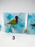 Charger l'image dans la visionneuse de la galerie, A square decorative tile featuring a mirror bird figure with a blue and turquoise marbled background, shown on a white surface with a black number 3 below it.
