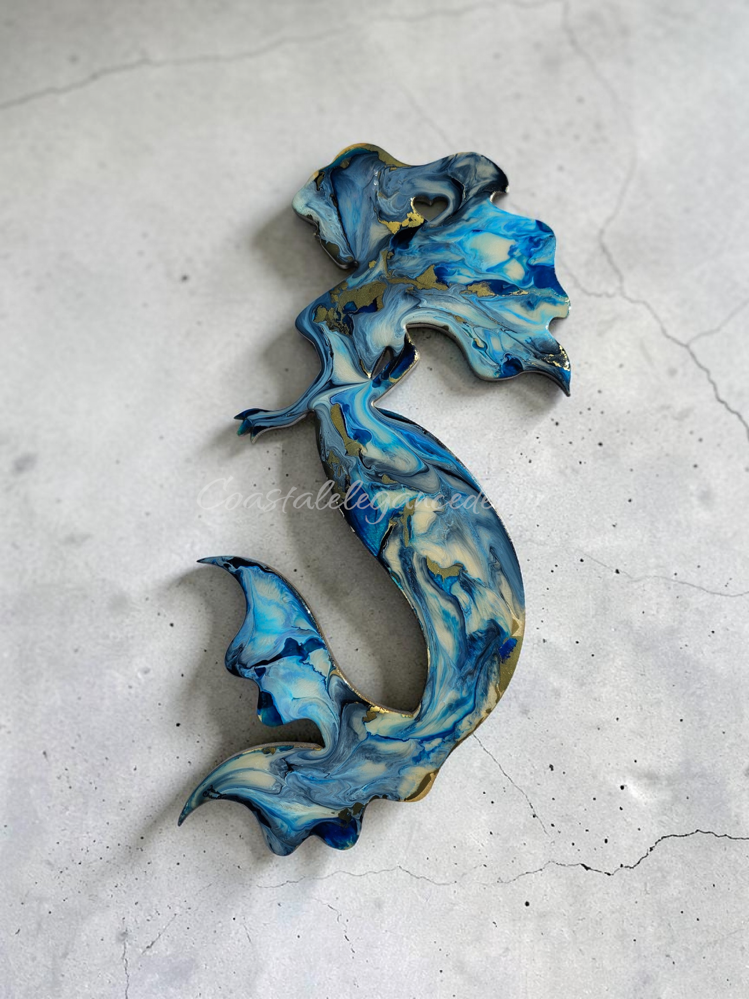 Deep blue with electric blue and cream accents handmade resin mermaid decoration.