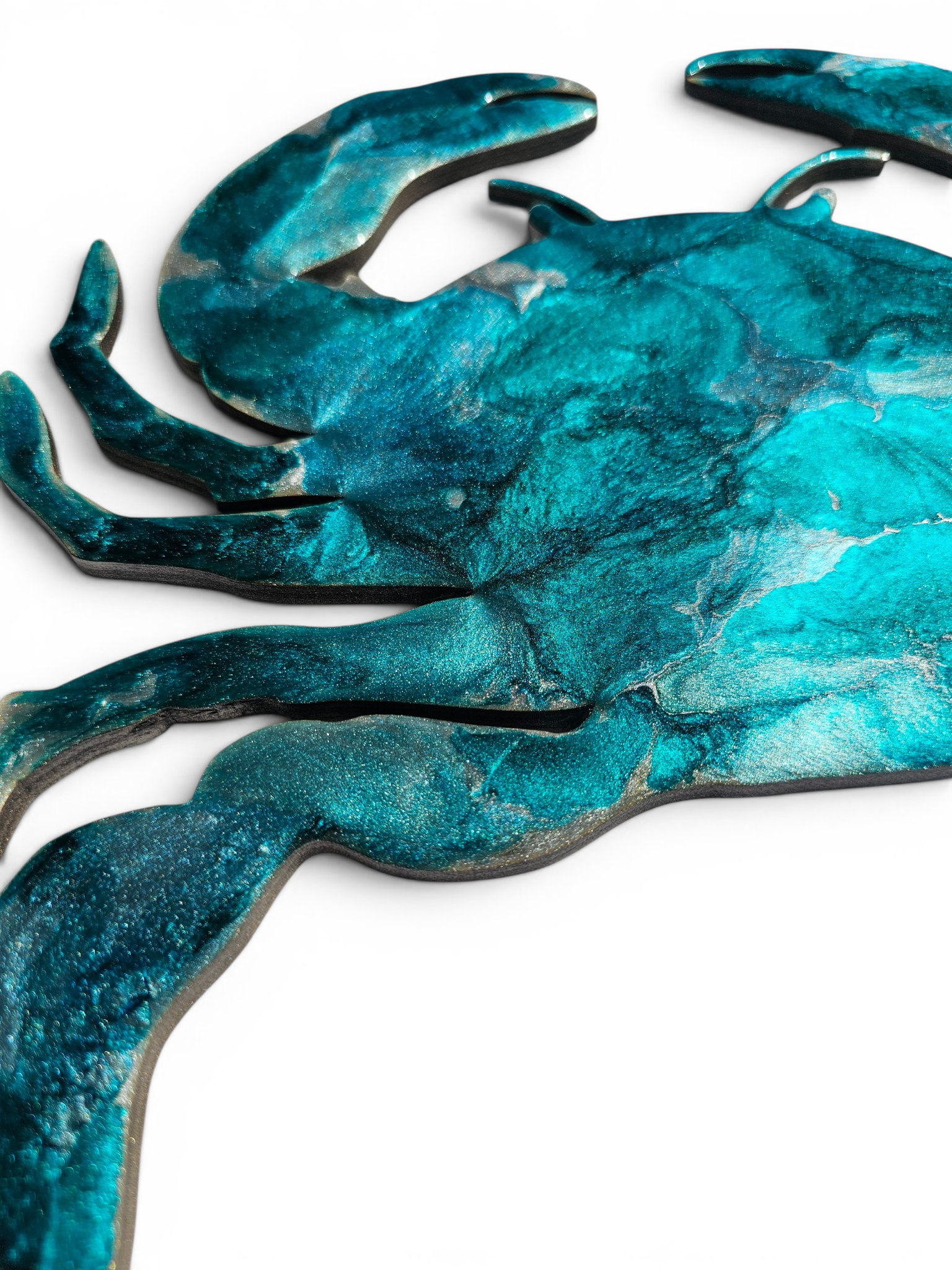 Teal and silver shimmery close up of a resin handmade crab