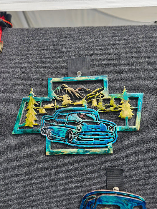 Close-up view of 1957 Chevy Handmade Wood and Resin Garage Car Art, highlighting the intricate details and craftsmanship in vibrant colors.