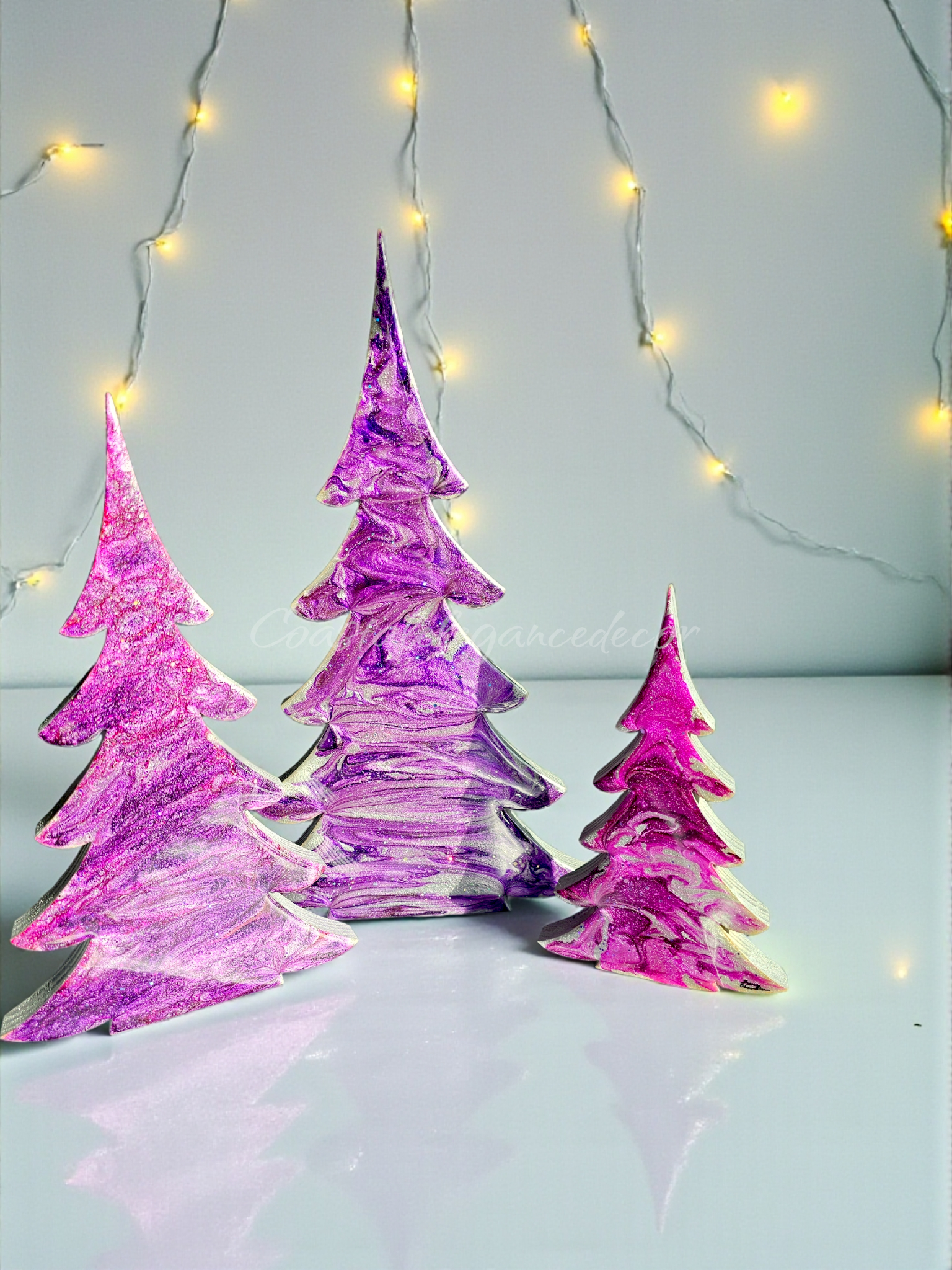 Handmade Purples and Fuschia Resin Wood Christmas Trees - Cheerful holiday mantelpiece decorations in three sizes (XL 15", Lg 12", Medium 8") featuring unique patterns and swirls, perfect for festive indoor decor.