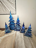 Load image into Gallery viewer, Set of Handmade Cobalt and Silvery Blue Resin Wood Christmas Trees for Holiday Mantelpiece, showcasing three sizes by Coastal Elegance Decor.
