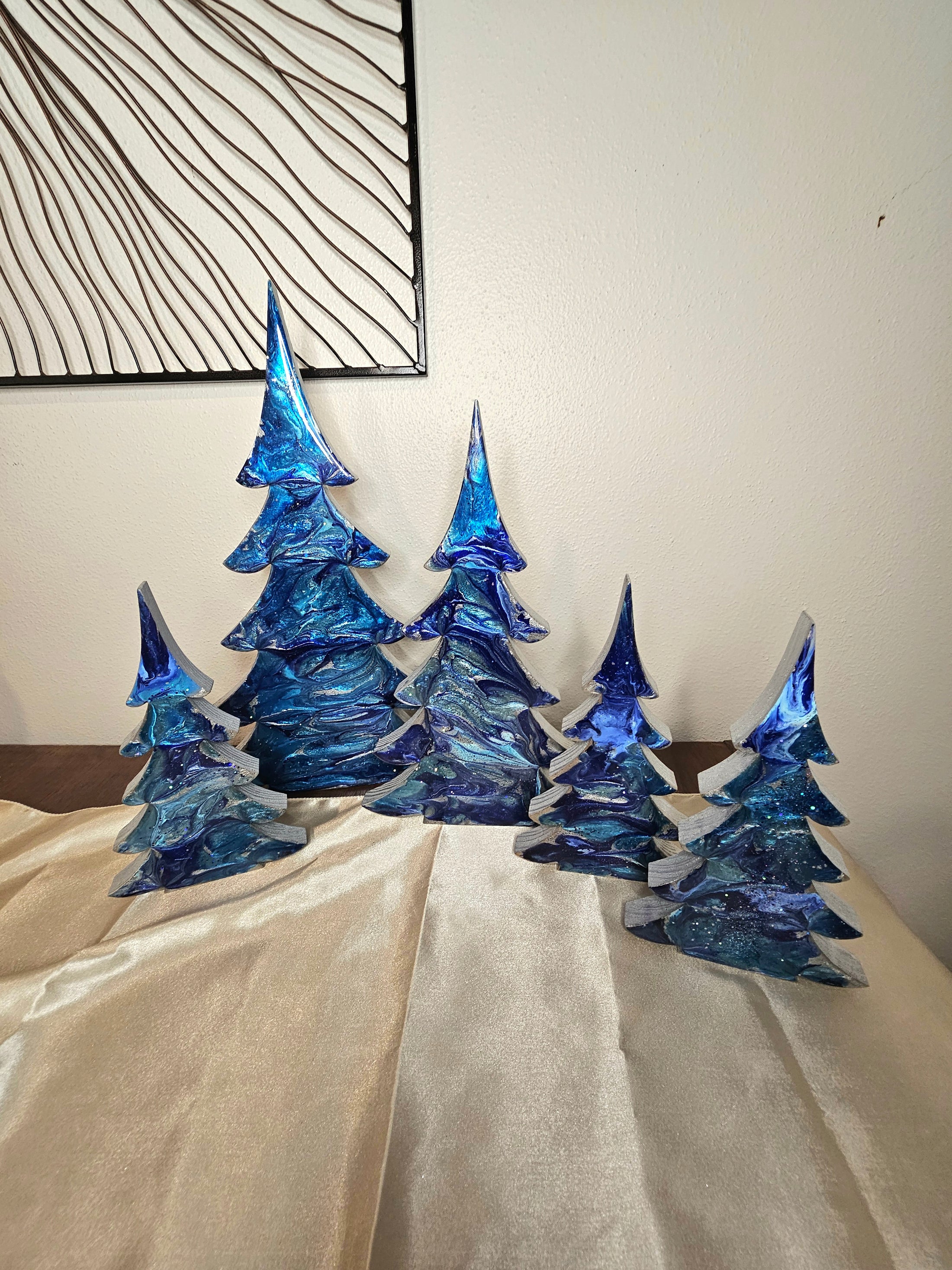 Set of Handmade Cobalt and Silvery Blue Resin Wood Christmas Trees for Holiday Mantelpiece, showcasing three sizes by Coastal Elegance Decor.