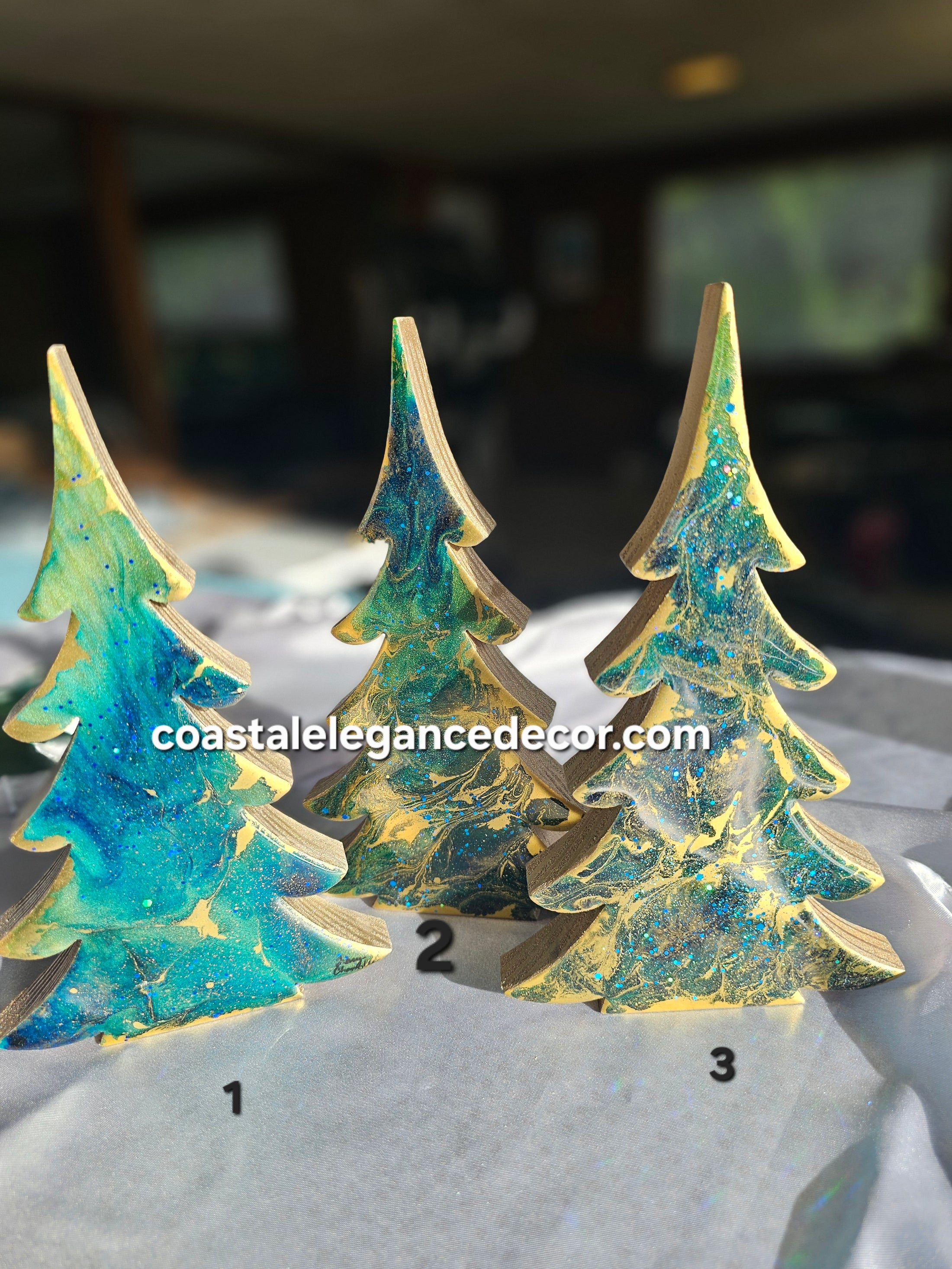 Close-up of Handcrafted Blue-Green Tabletop Sparkly Christmas Trees 8 Inches highlighting the gemtone resin and artistic craftsmanship.