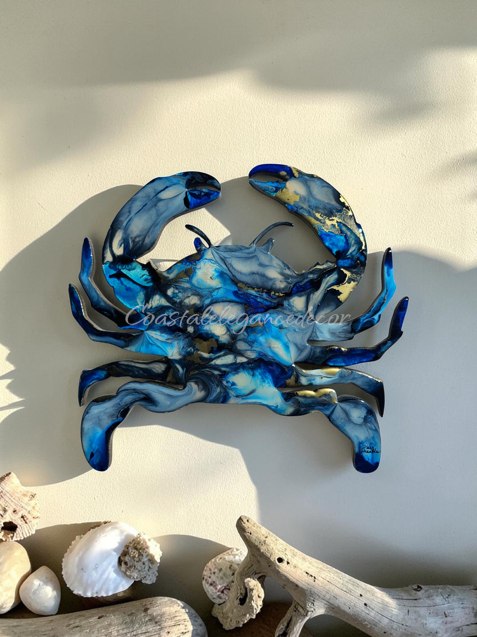 Variegated blue resin crab accented with gold metallic 