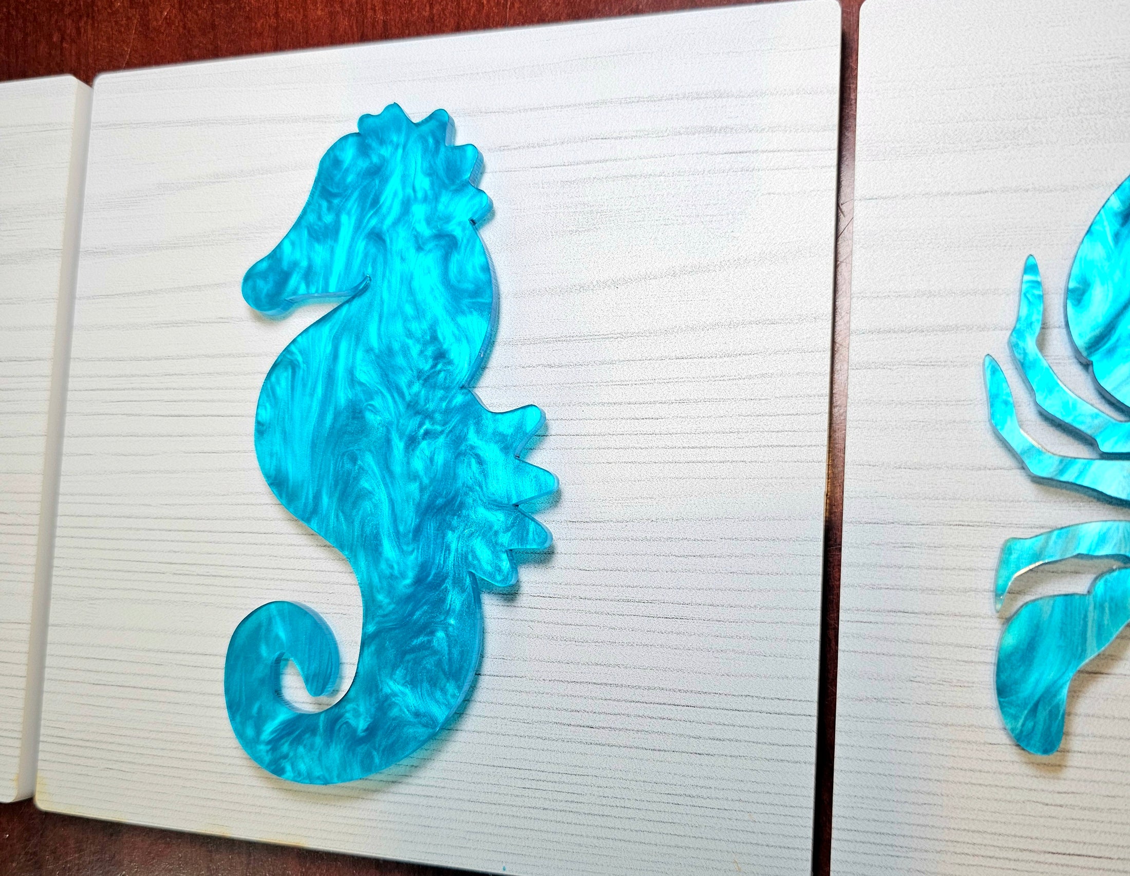 Blue seahorse design on a whitewashed background 