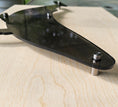 Load image into Gallery viewer, Close-up of a laser-engraved humpback whale silhouette in translucent smoke-colored acrylic, showing the polished 1/4 inch thick edges and intricate detail
