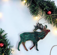 Charger l'image dans la visionneuse de la galerie, Handmade elk Christmas ornaments with lights and boughs.
