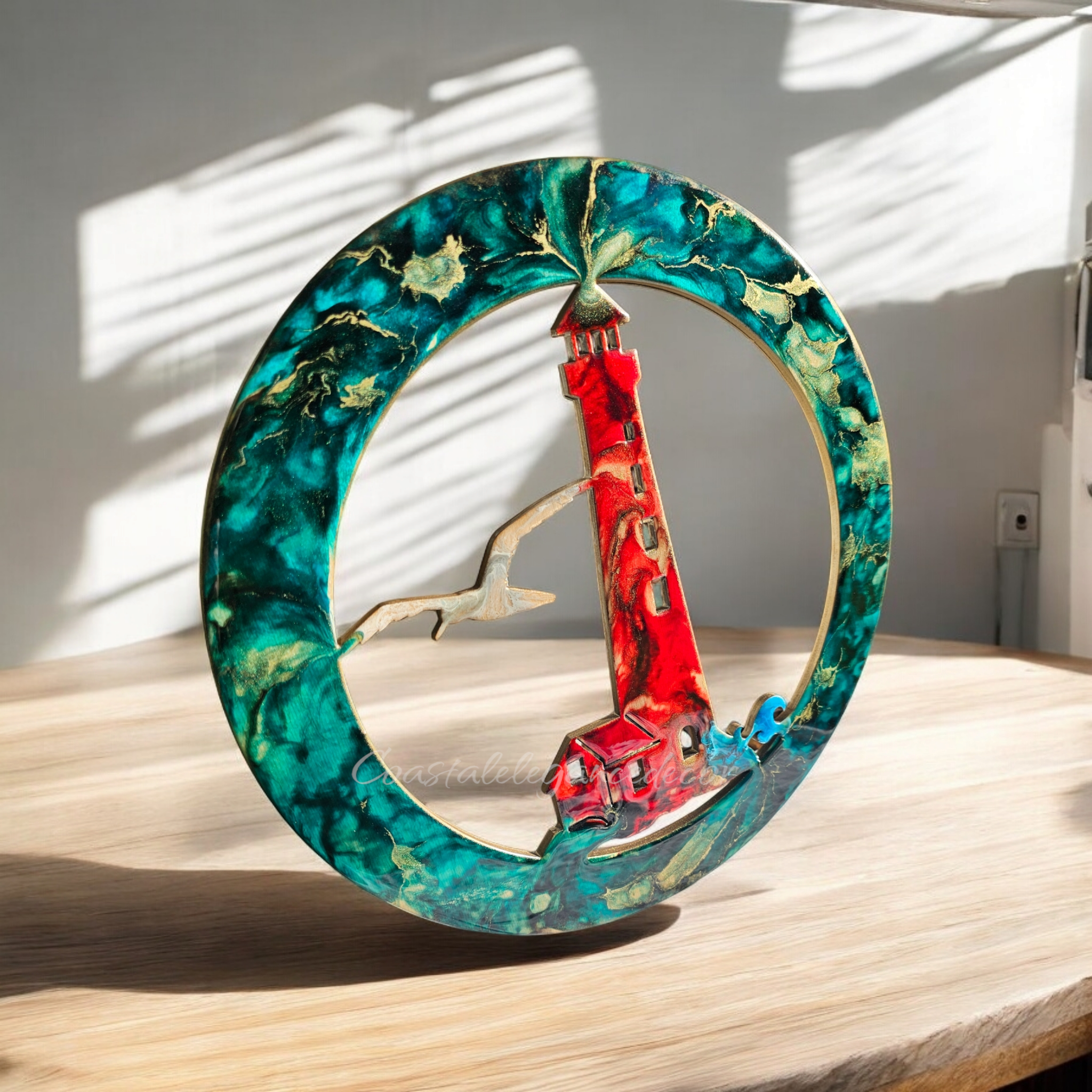 Lightweight and colorful coastal lighthouse wall decor, featuring handmade resin on wood, ideal for a beach-themed interior.