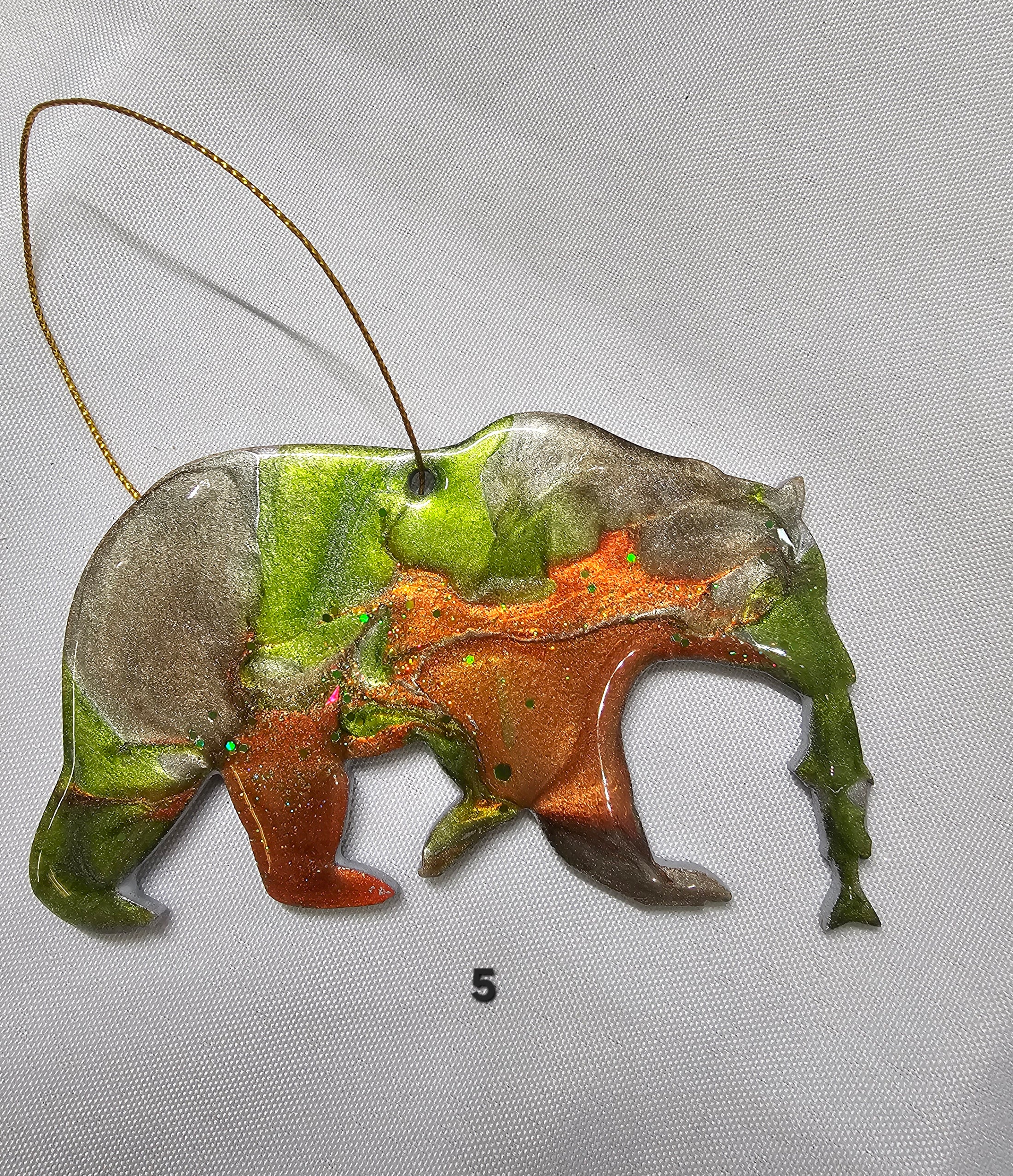 Handmade Grizzly Bear Christmas Ornament with Salmon - Rustic Wildlife Cabin Decor featuring a colorful resin overlay and metallic accents.