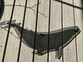 Load image into Gallery viewer, Modern smoke acrylic humpback whale wall hanging casting dramatic dancing shadows and light reflections on a sunlit wall
