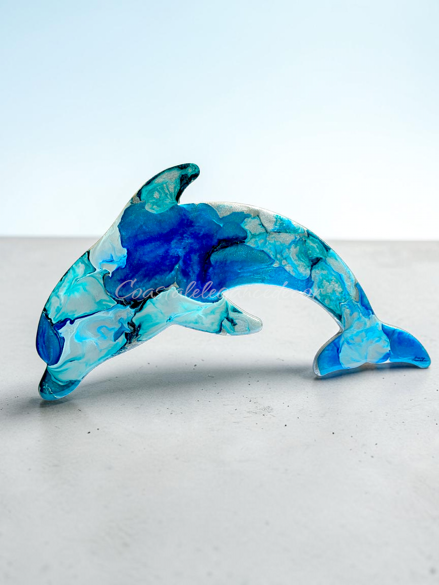 Shimmery silver and cobalt blue with teal highlighted 15" dolphin handmade resin all decoration.