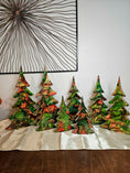 Load image into Gallery viewer, Handmade Green and Red Resin Christmas Trees with Branches Holiday Mantelpiece in a cozy setting - XL 15" size.
