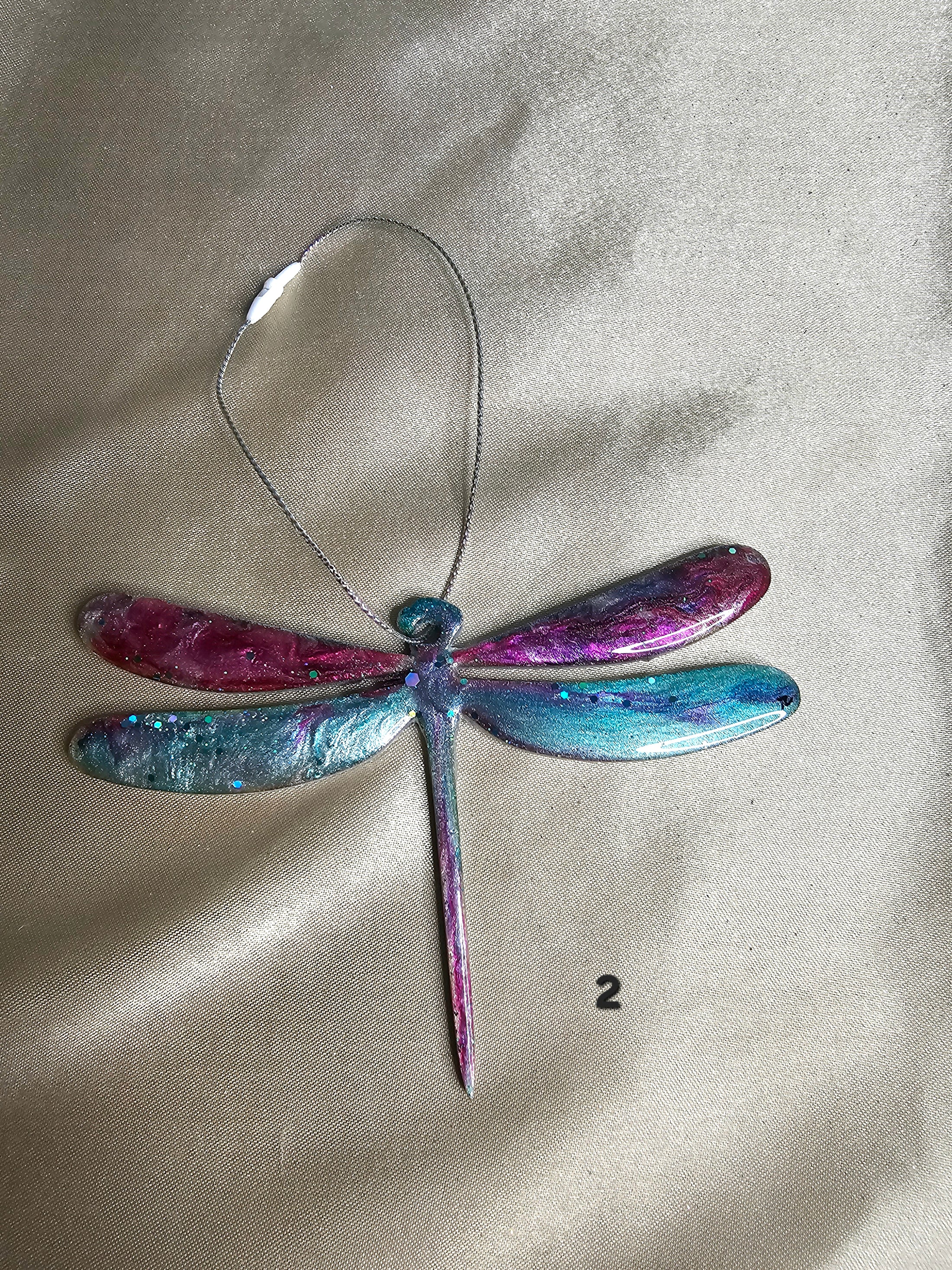 Handmade Nature Dragonfly Christmas Tree Keepsake Ornament displayed on a mantle, adding a charming touch to home decor.