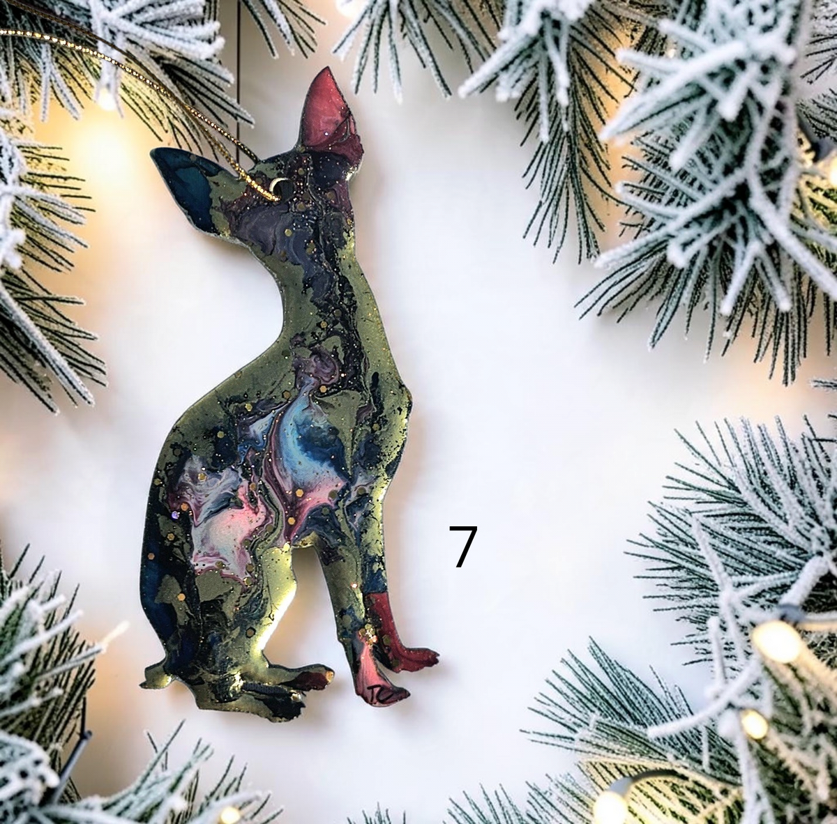 Chihuahua dog ornament on a white background with Christmas lights 