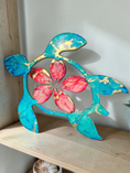 Load image into Gallery viewer, Side shot of a Tropical turquoise turtle with red Hawaiian flowers on a shelf handmade resin on wood
