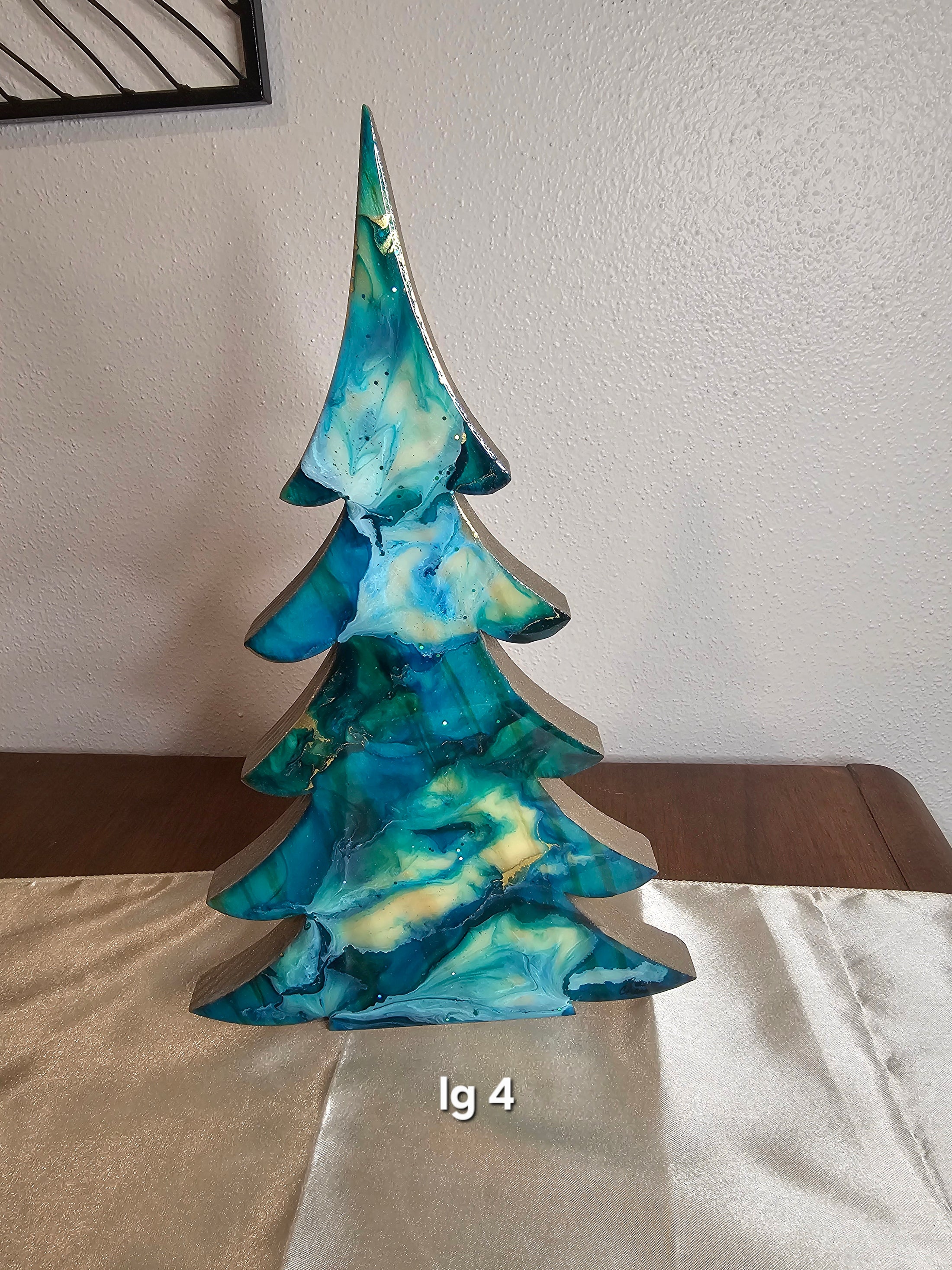 Collection of Handmade Teal and Gold Christmas Trees with Branches Holiday Shelf Sitters, highlighting unique handcrafted designs for a joyful holiday ambiance.