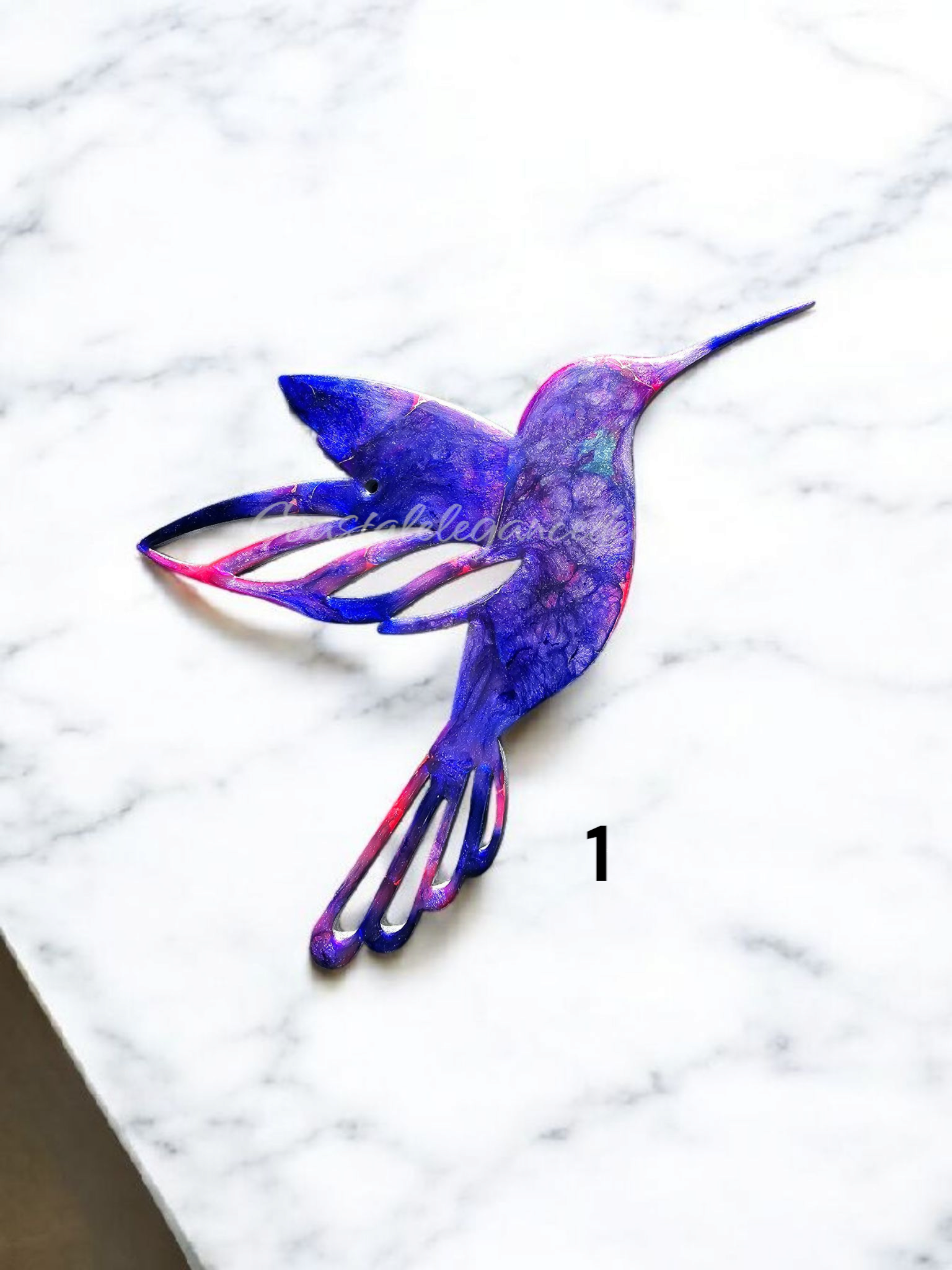 A stunning colorful hummingbird wall decoration, showcasing handmade resin on wood with vibrant colors and metallic accents.