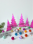 Load image into Gallery viewer, Hot Pink Silver Evergreen Christmas Trees Mantel Sitter Holiday Tabletop Decoration in 8 inch size.
