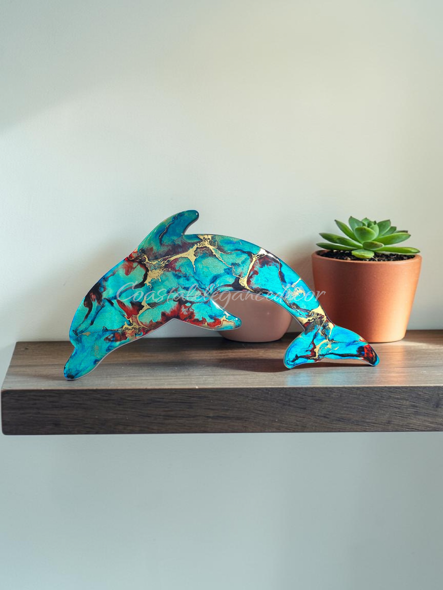 Turquoise and red with gold highlighted 15" dolphin handmade resin all decoration.